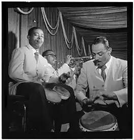 Vidal on conga (right) playing alongside José Mangual on bongos (left) and trumpeter Mario Bauzá (center) at the Glen Island Casino, New York, 1947