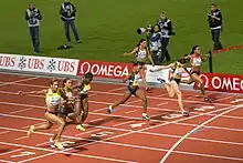 Image 20The finish of a women's 100 m race (from Track and field)
