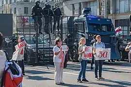 Special vehicles of the internal troops or AMAP/OMON: moving two-level fences and water cannons with dozer blades