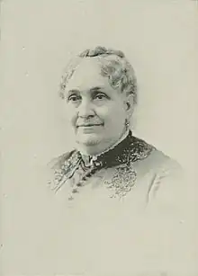 Sepia-colored photograph of a middle-aged white woman.