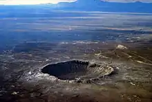 Image 9Meteor Crater in Arizona. Created 50,000 years ago by an impactor about 50 metres (160 ft) across, it shows that the accretion of the Solar System is not over. (from Formation and evolution of the Solar System)