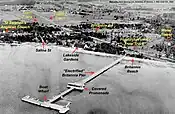 The wooden, 442m-long Britannia pier. During the 1960s, the pier was widened from about 9m to 74m (consult GeoOttawa aerial photos timeline). The village is to the left of Lakeside Gardens (1920).