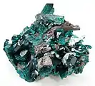 Dioptase with Cerussite, Christoff Mine, Kunene Region, Namibia. 6.9 × 5.7 × 4.8 cm