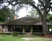The historic Village Hall Log Cabin, which serves as Commission chambers for all meetings, as well as other Board meetings, and for special events.