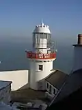 The active Wicklow Head Lighthouse was built in the 19th century, and operated by the Commissioners of Irish Lights.