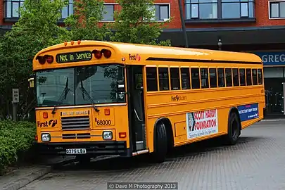 First Student Blue Bird TC/2000 in Essex; bus is imported from the United States.