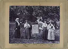 Helga Gill pictured with Mary Bury, Vera Collison, and Miss Meynell on the first First Suffrage Caravan Tour through Leciester & Northamptonshire. also a horse and two dogs in the image