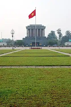 Flag of Vietnam in front of the Ho Chi Minh Mausoleum