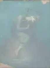 blurry photograph of a blindfolded girl sitting on an orange