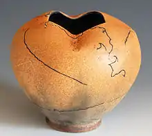 Pot with an example of horsehair raku technique. The vessel was taken out of the kiln at 732 Celsius and horsehair applied on, which burned into it.