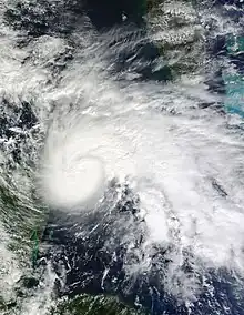 A sprawling hurricane over the Yucatán Channel, with clouds from the storm covering much of the Caribbean