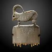 Ibex comb; 3800–3500 BC; hippopotamus ivory; 6.5 × 3.8 × 0.2 cm; Louvre