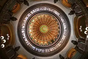 Image 47The dome of the Illinois State Capitol. Designed by architects Cochrane and Garnsey, the dome's interior features a plaster frieze painted to resemble bronze and illustrating scenes from Illinois history. Stained glass windows, including a stained glass replica of the State Seal, appear in the oculus. Ground was first broken for the new capitol on March 11, 1869, and it was completed twenty years later. Photo credit: Daniel Schwen (from Portal:Illinois/Selected picture)