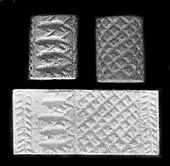 Jemdet Nasr-style Mesopotamian cylinder seal, from Grave 7304 Cemetery 7000 at Naqada, Egypt, Naqada II period. This is an example of early Egypt-Mesopotamia relations.