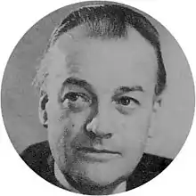 head and shoulders shot of a middle-aged man, slightly balding