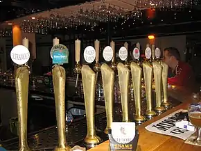 A series of draught beers on tap.