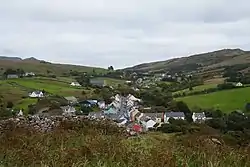 View from the monastic site at the old church down to the village, looking east. The R263 is to be seen as it leaves Kilcar in direction to Killybegs