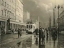 Rainy street with tram in Brussels, 1937