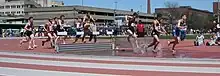 Image 23Men traversing the water jump in a steeplechase competition (from Track and field)