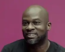 Joseph against a pink background