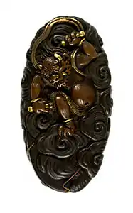 Sword pommel depicting Raijin. Edo period, 1800-1500.