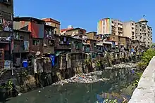 Slum houses next to water