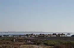 Khniss is a small city in the Tunisian Sahel region. It is located on the coast, 5 km south of Monastir. Its population is estimated at around 11,000 as of 2014.