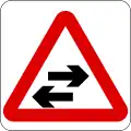 Two-way traffic crosses a one-way road