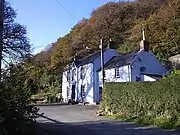 The Dyffryn Arms, Pontfaen located below a wooded escarpment