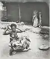 Krobo girl dressing her hair, late 19th century