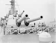 Two metal structures, each with two large gun barrels protruding from their fronts