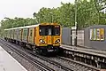 A Class 507 arrives with a service to Liverpool Central.