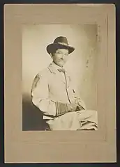Civil War veteran in United Confederate Veterans (UCV) uniform wearing a Southern Cross of Honor