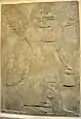 Wall relief depicting an eagle-headed and winged man, Apkallu, from Nimrud.