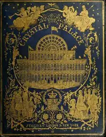 The cover of an old book title "THE CRYSTAL PALACE" showing in yellow or gold the Crystal Palace surrounded by allegorical figures. The background is dark green.